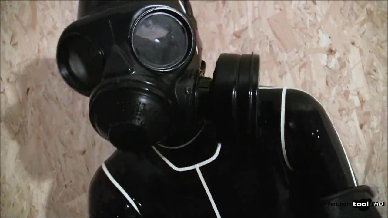 Gas Mask and Latex Catsuit