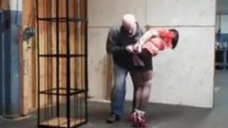 Caged in tight bondage