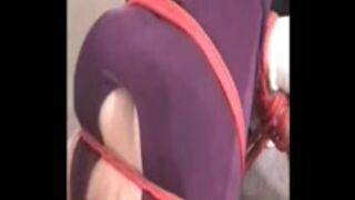 Hogtied with red rope