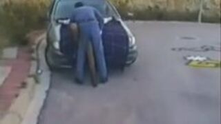 Bondage on car hood Outdoors