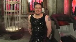 Dominatrix and slave boy in Dungeon