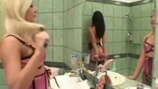 Lesbian Strap-on Mistress and her brunette slave girl