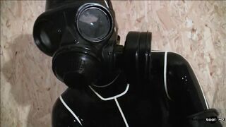 Gas Mask and Latex Catsuit