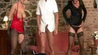 High heeled dommes dominating two submiss ...