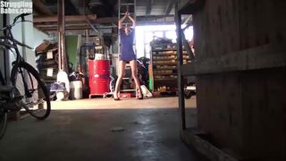 tied to ladder ballgagged titgrabbed