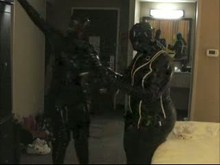 Two hoes in Rubber Wearing Gas Masks